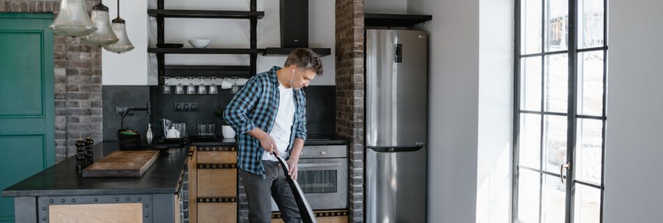 Man Cleaning Kitchen