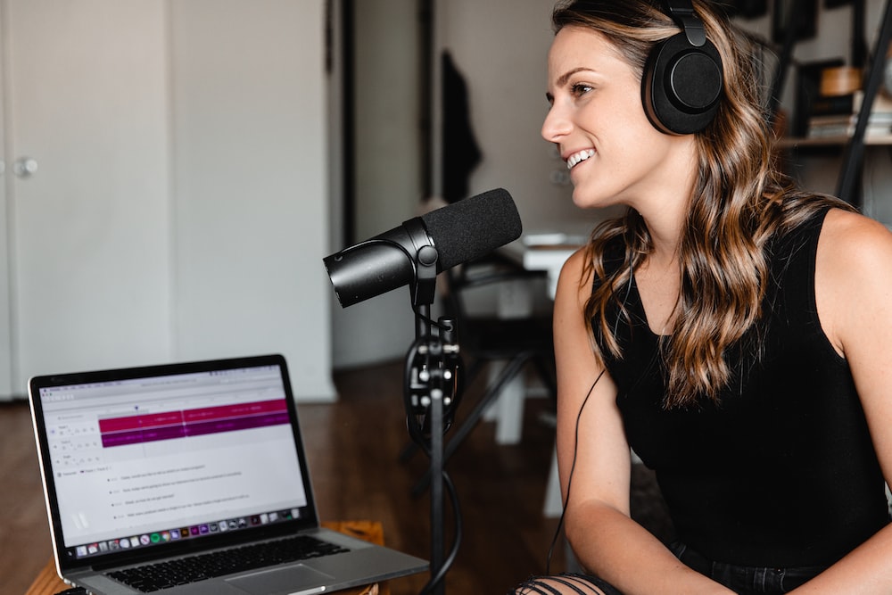 Female podcaster engaging with her listeners